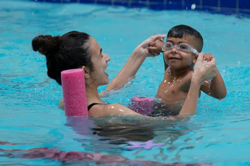 child learning freestyle during early swim lessons at Felix Swim Schools Toronto